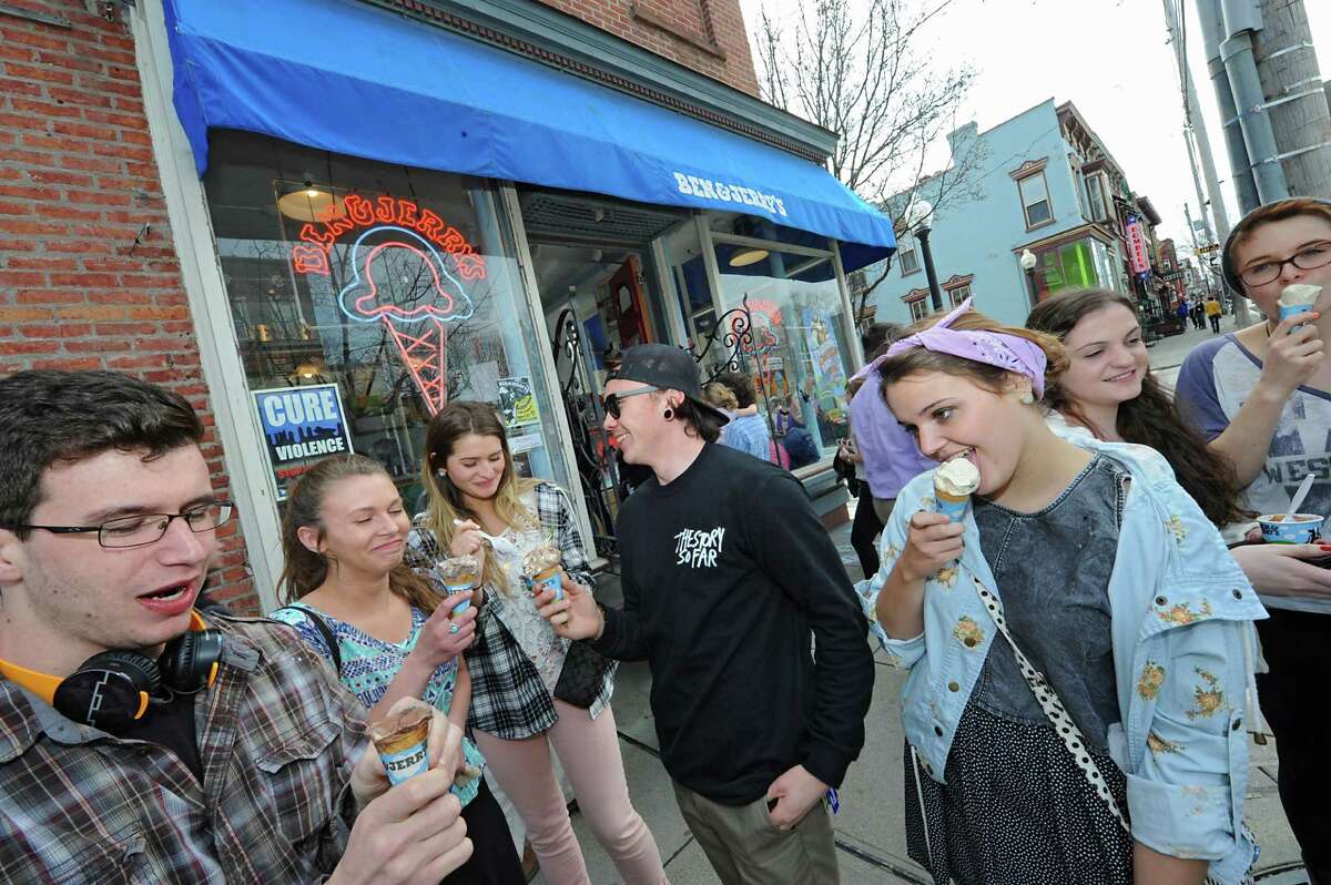 A group of art students from The College of Saint Rose enjoy some ice cream outside Ben & Jerry's Ice Cream Shop on Lark St. during "Free Cone Day" on Tuesday, April 14, 2015 in Albany, N.Y. (Lori Van Buren / Times Union archive)