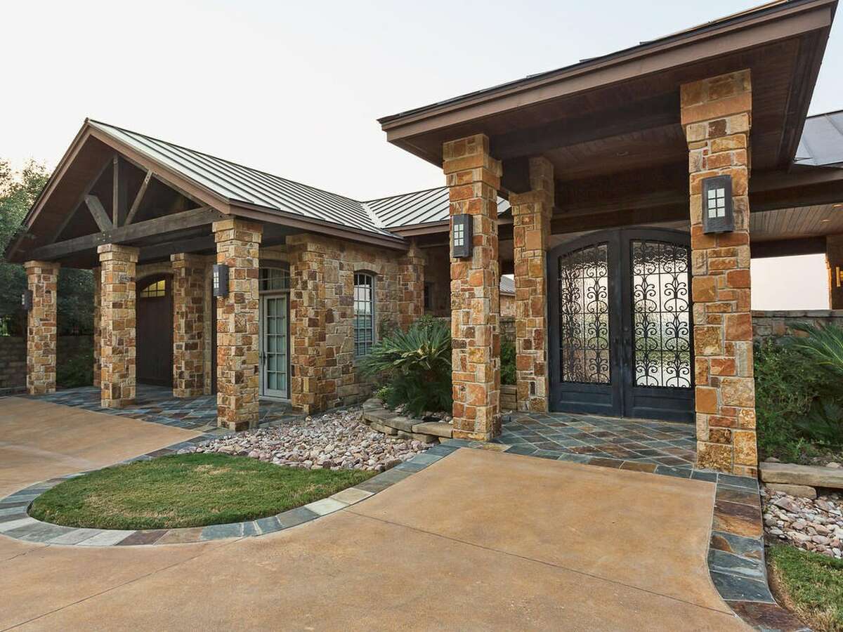 The home features mesquite wood in doors, floors and exposed beams, which were taken from Kent's Texas ranch.