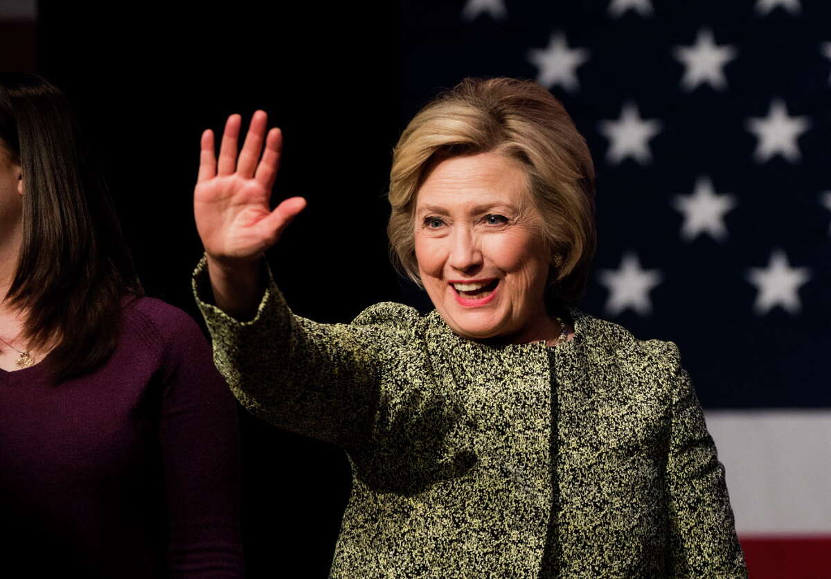 PORT WASHINGTON, NEW YORK - APRIL 11: Democratic presidential candidate Hillary Clinton waves during a conversation on gun violence at the Landmark Theater on April 11, 2016 in Port Washington, New York. The New York Democratic primary is scheduled for April 19th. (Photo by Andrew Theodorakis/Getty Images) ORG XMIT: 628887019