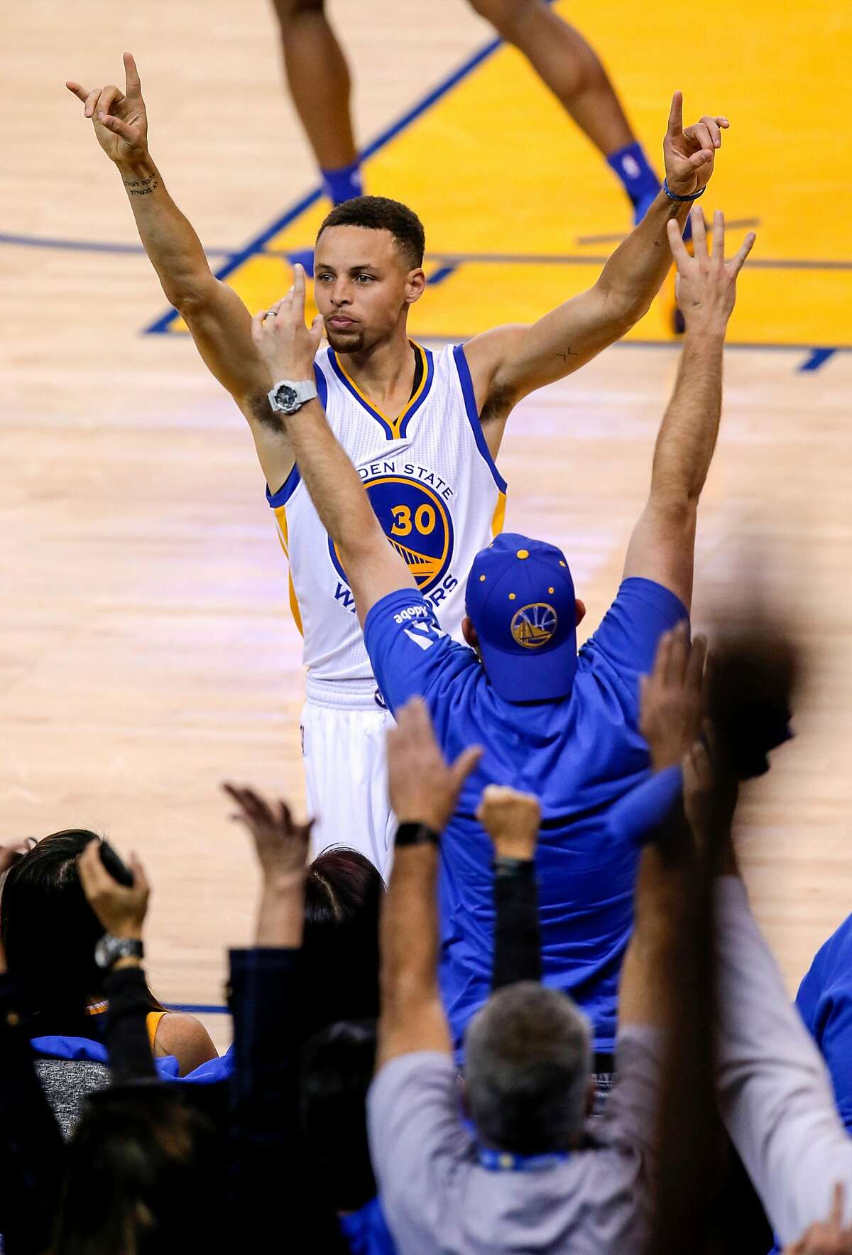 Stephen Curry celebrates his 400th three point shot of the season during the third quarter as the Golden State Warriors take on the Memphis Grizzlies ,at the Oracle Arena in Oakland, California on Wed. April 13, 2016.