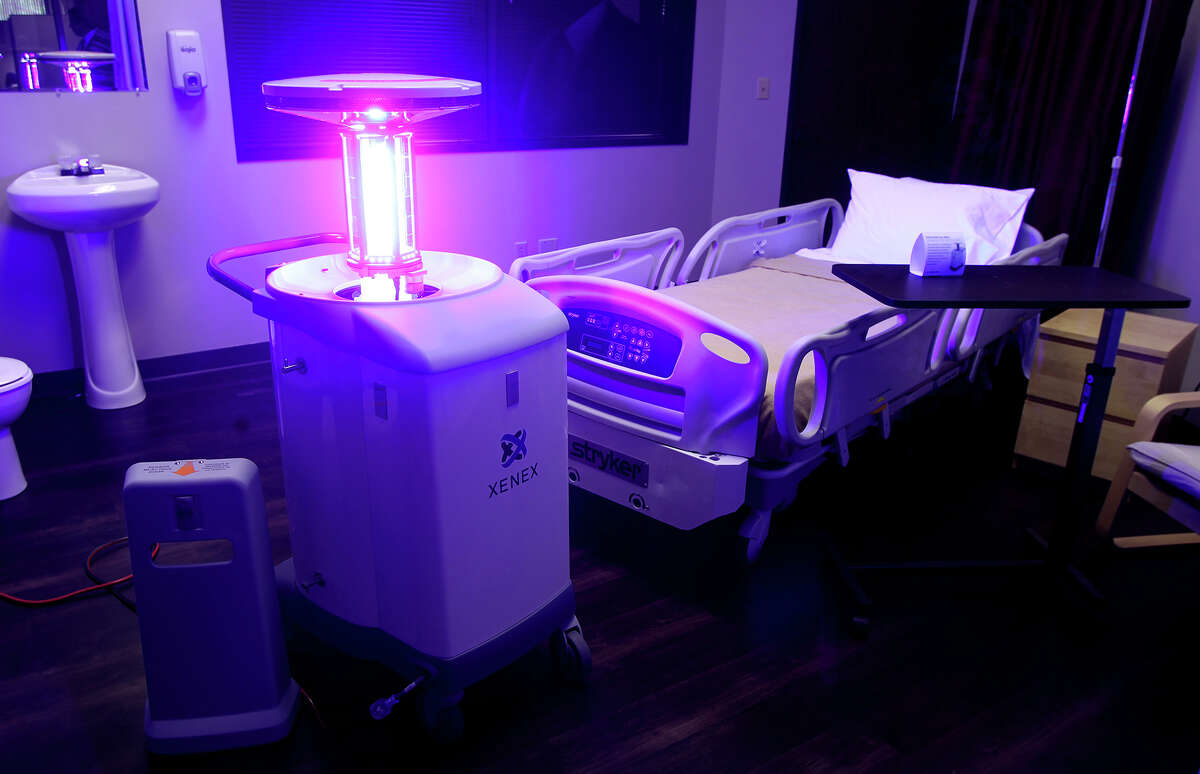 A Xenex robot emits ultraviolet light in a simulated hospital room at San Antonio-based Xenex. The device is used to disinfect and eliminate pathogens in hospitals. The company received the largest San Antonio venture capital investment last year, $25 million.