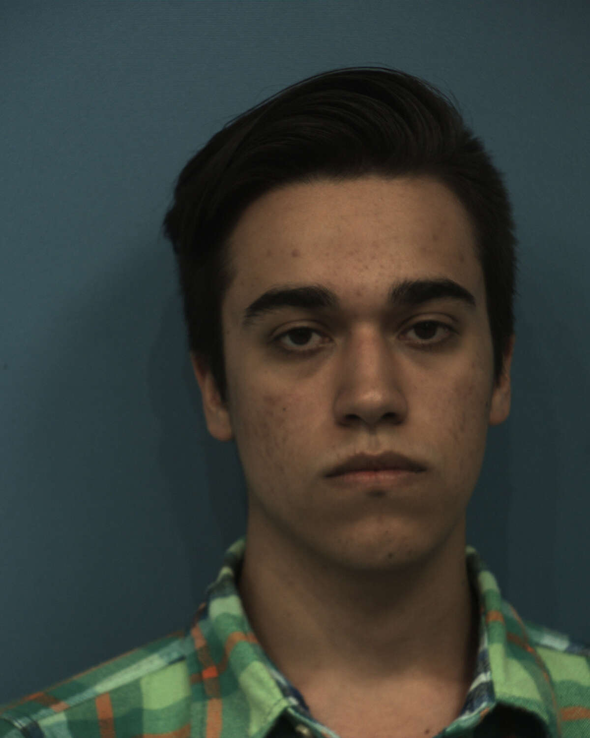 Tyler Reid Johnson — an educational assistant at McNeil High School in Round Rock — was arrested Wednesday and charged with sexual assault of a child, Williamson County jail records show.