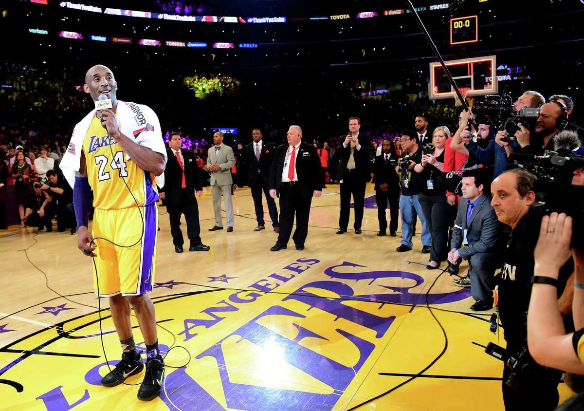 LOS ANGELES, CA - APRIL 13: Kobe Bryant #24 of the Los Angeles Lakers addresses the crowd after scoring 60 points in his final NBA game at Staples Center on April 13, 2016 in Los Angeles, California. The Lakers defeated the Utah Jazz 101-96. NOTE TO USER: User expressly acknowledges and agrees that, by downloading and or using this photograph, User is consenting to the terms and conditions of the Getty Images License Agreement. (Photo by Harry How/Getty Images) ORG XMIT: 575732179
