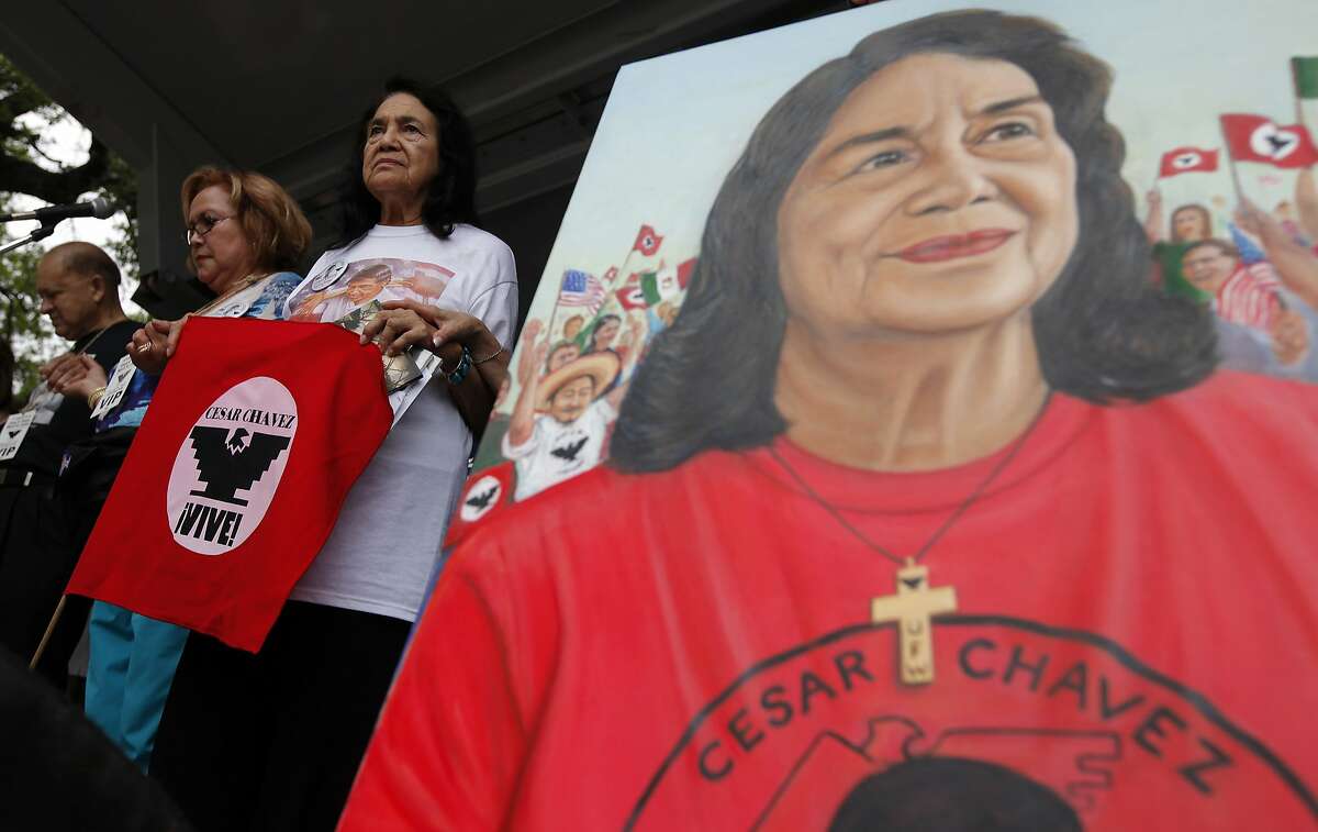 Dolores Huerta stands beside a painting of herself at the 15th annual Cesar Chavez March for Justice on Saturday, Mar. 26, 2011. Huerta is the co-founder of United Farm Workers of America with famed labor rights leader Cesar Chavez. Huerta was the keynote speaker at the event. Kin Man Hui/kmhui@express-news.net