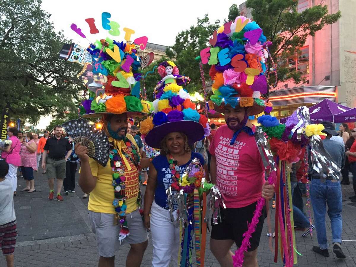 Uriel Diaz, Maria Vega & John Paul Diaz spent 5 hours making their hats. "We love Fiesta!"