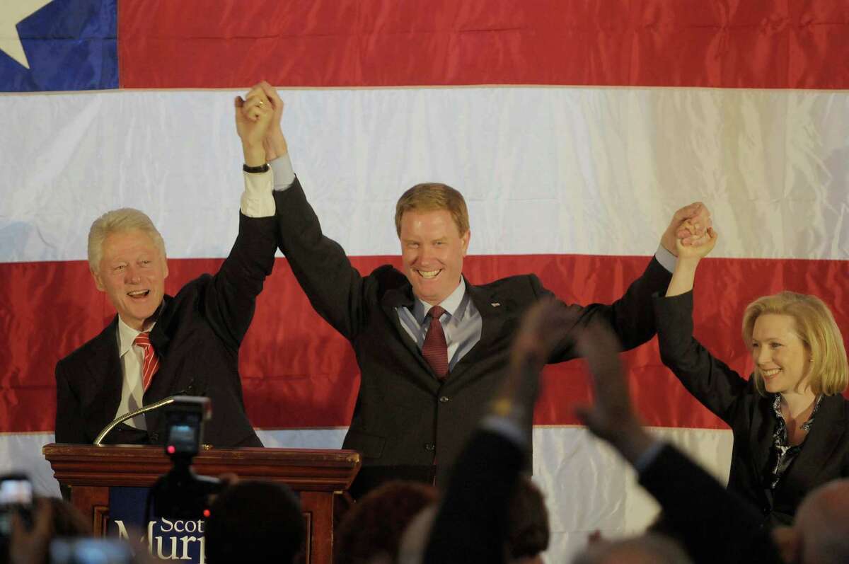 Former President Bill Clinton, left, U.S. Congressman Scott Murphy, center, and U.S. Senator Kirsten Gillibrand, right, take part in a rally at the Hall of Springs in Saratoga Springs, NY on Monday morning, Nov. 1, 2010. (Paul Buckowski / Times Union)