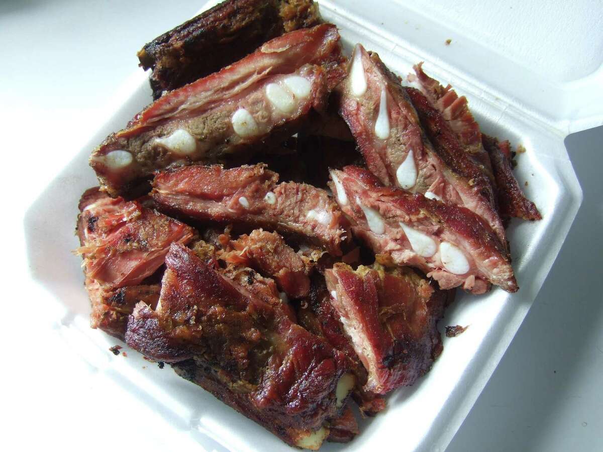 A styrofoam container of "regulars" at Burns BBQ. Regulars is leftover trimmings of pork spare ribs.
