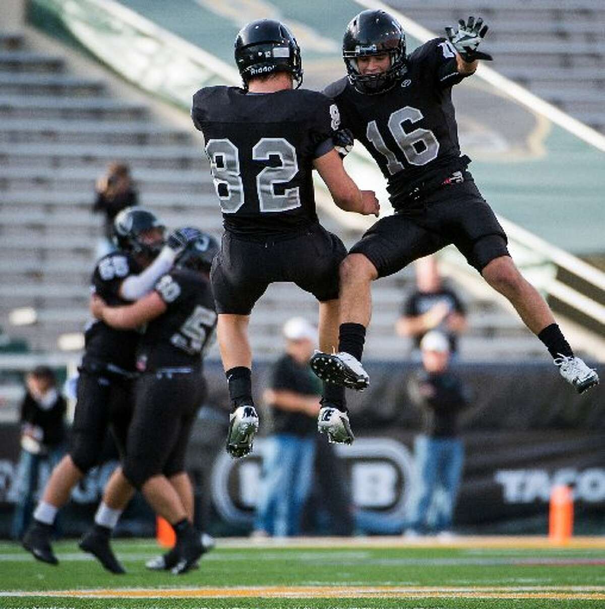 Cibolo Steele defensive back Tyler Petoskey (16) and tight end Matthew Moen (82) celebrate after the Knights recovered a Katy fumble during the second quarterin a Class 5A Division II state high school football semifinal game at Floyd Casey Stadium on Saturday, Dec. 15, 2012, in Waco.