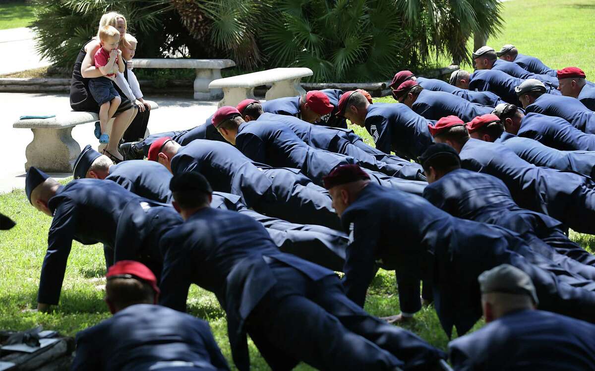 Memorial Pushups following the Memorial Service for Lt Col William A. Schroeder in Gateway Chapel at Joint Base San Antonio-Lackland on Friday, April 15, 2016.