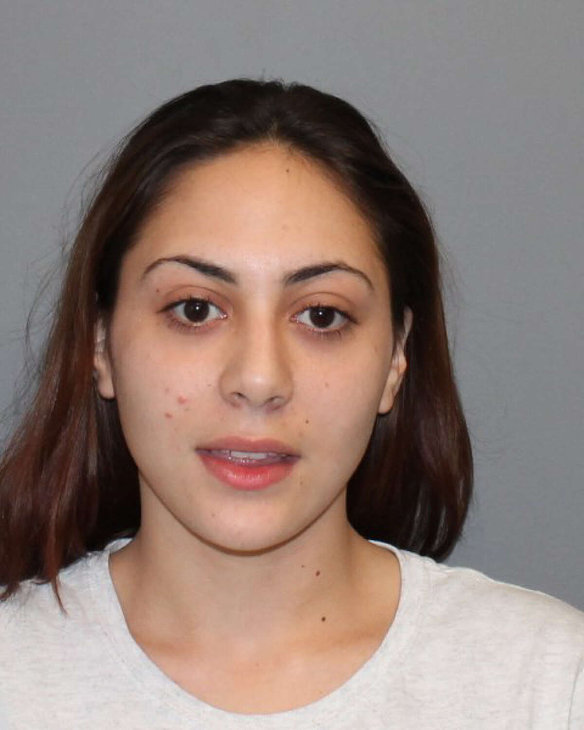Hilary Guillen, 21 of 6 Leuvine St. in Norwalk, was arrested on Thursday, April 15, 2016 on numerous drug charges. Police said in Guillen, 21 of 6 Leuvine St., is the girlfriend of Sylvester Edwards who was arrested on April 6, 2016, They said Guillen was continuing the heroin distribution ring while Edwards was incarcerated. Police found a drug factory inside a Flax Hill Road condominium where they seized more than 670 packaged heroin and another 49 grams of the drug. Also found in the “drug factory” were more than 7,000 empty bags ready to be bagged, an electronic scale, multiple ounces of cutting agent, an electronic blender for processing the heroin and cutting agents, hundreds of rubber bands for bundling the packaged heroin, hundreds of plastic bags for packaging and an ink stamp for marking product.