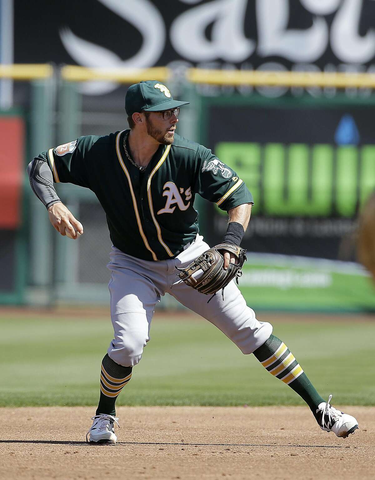 Oakland Athletics second baseman Eric Sogard against the San Francisco Giants during a spring training baseball game in Scottsdale, Ariz., Monday, March 21, 2016. (AP Photo/Jeff Chiu)