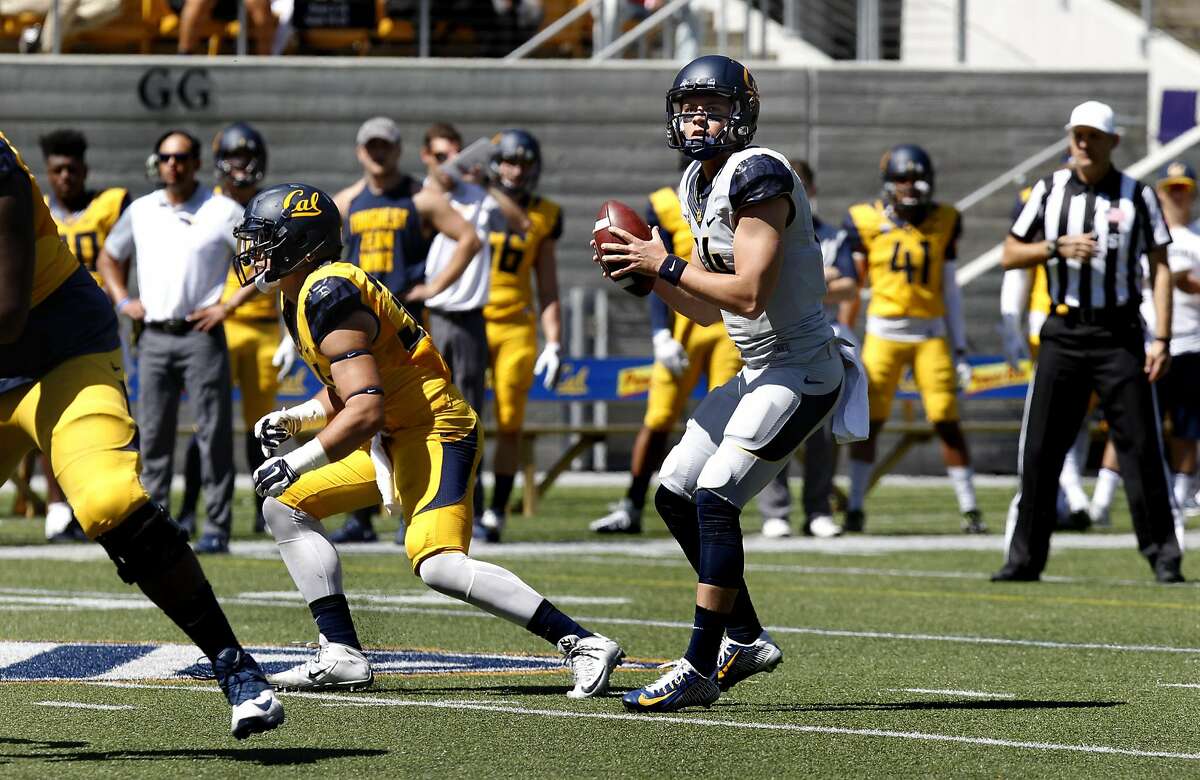 Quarterback Chase Forrest, center, prepares to throw a pass during UC Berkeley's Cal Football Spring Scrimmage in Berkeley, Calif., on Saturday April 16, 2016