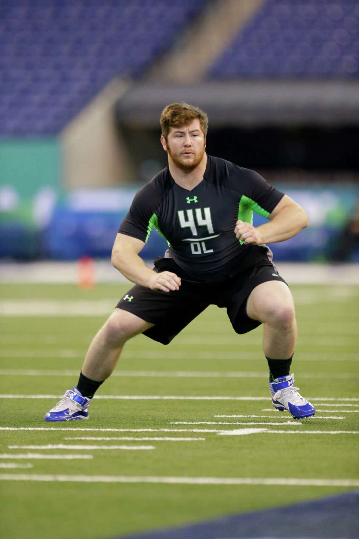 North Carolina State offensive lineman Joe Thuney runs a drill at the NFL football scouting combine in Indianapolis, Friday, Feb. 26, 2016.