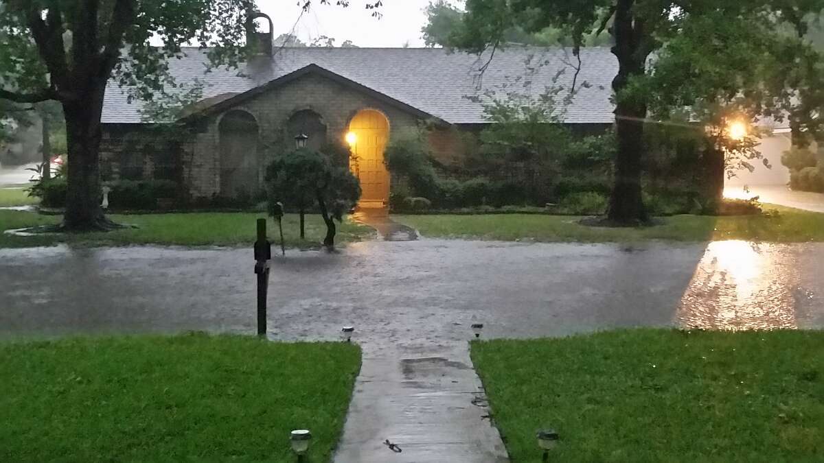 Rain floods streets in Spring Shadows neighborhood near Gessner and Kempwood in northwest Houston.