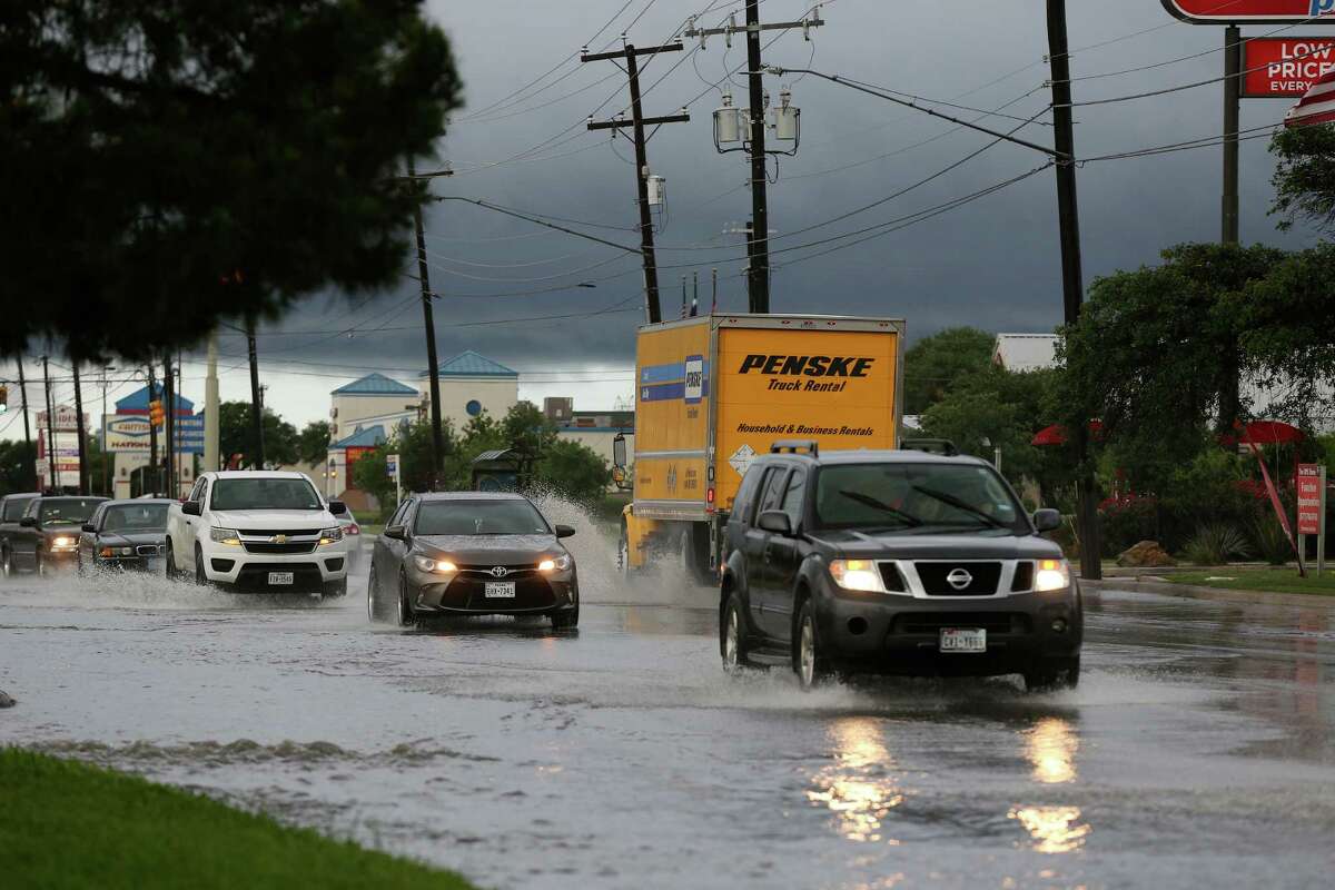 Street flooding impacts Marbach Road as thunderstorms move into the area.