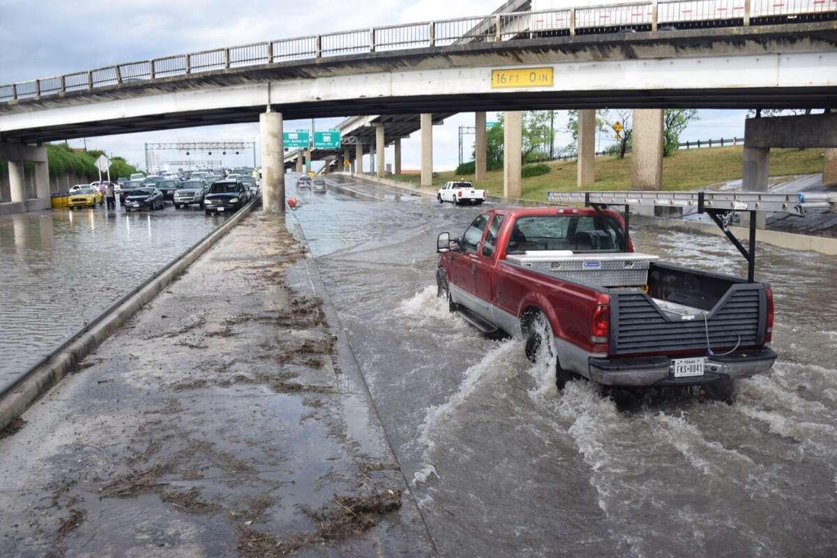Heavy rain caused water to completely cover the road at the Interstate 35 and Loop 410 interchange on the Northeast Side, April 18, 2016.