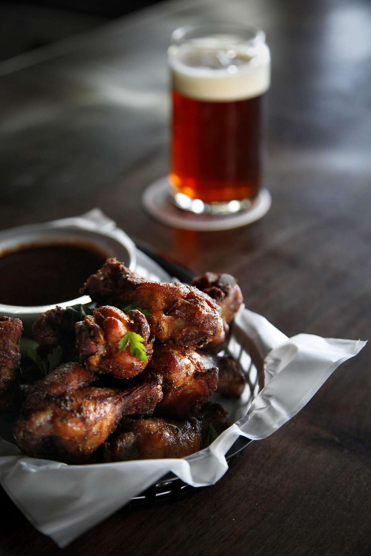 The cherry wood smoked wings are a specialty at Taps in Petaluma, Calif., on Tuesday, April 12, 2015.