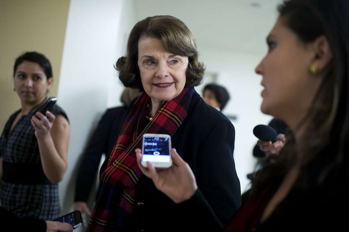 UNITED STATES - DECEMBER 08: Sen. Dianne Feinstein, D-Calif., talks with reporters in the basement of the Capitol before the Senate Policy luncheons, December 8, 2015. (Photo By Tom Williams/CQ Roll Call)