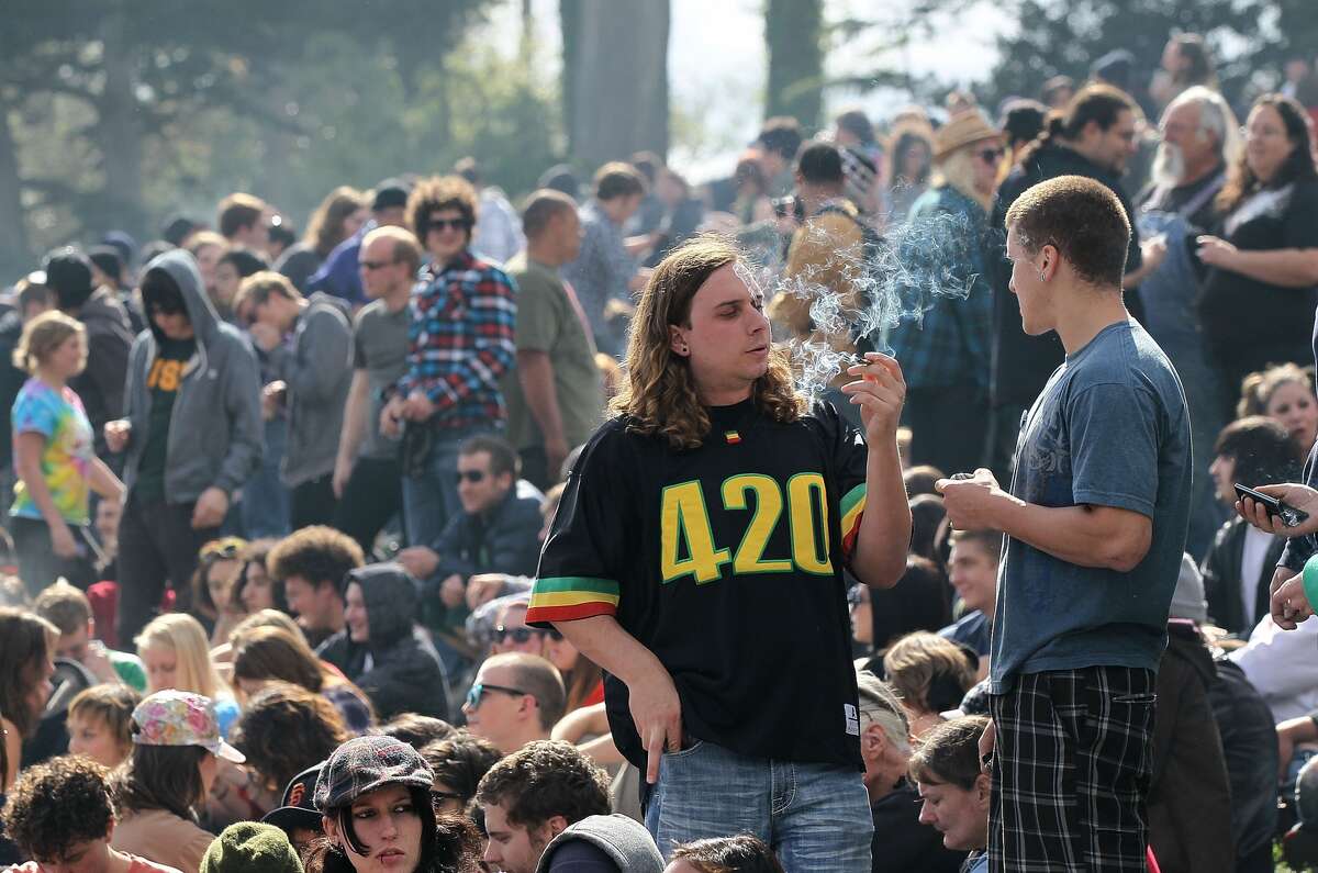 SAN FRANCISCO - APRIL 20: A marijuana user smokes marijuana during a 420 Day celebration on 'Hippie Hill' in Golden Gate Park April 20, 2010 in San Francisco, California. April 20th has become a de facto holiday for marijuana advocates, with large gatherings and 'smoke outs' in many parts of the United States. Voters in California will consider a measure on the November general election ballot that could make the State the first in the nation to legalize the growing of a limited amount of marijuana for private use. (Photo by Justin Sullivan/Getty Images)