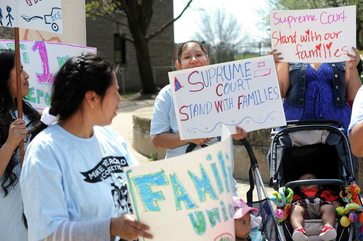 Nearly three dozen undocumented immigrants along with their U.S.-born children demonstrated at the U.S. District Court in Bridgeport, Conn. on Monday, April 18, 2016. The peaceful gathering, organized by Make The Road Connecticut, was called in response to U.S. Supreme Court hearing President Obama's executive order on immigration.