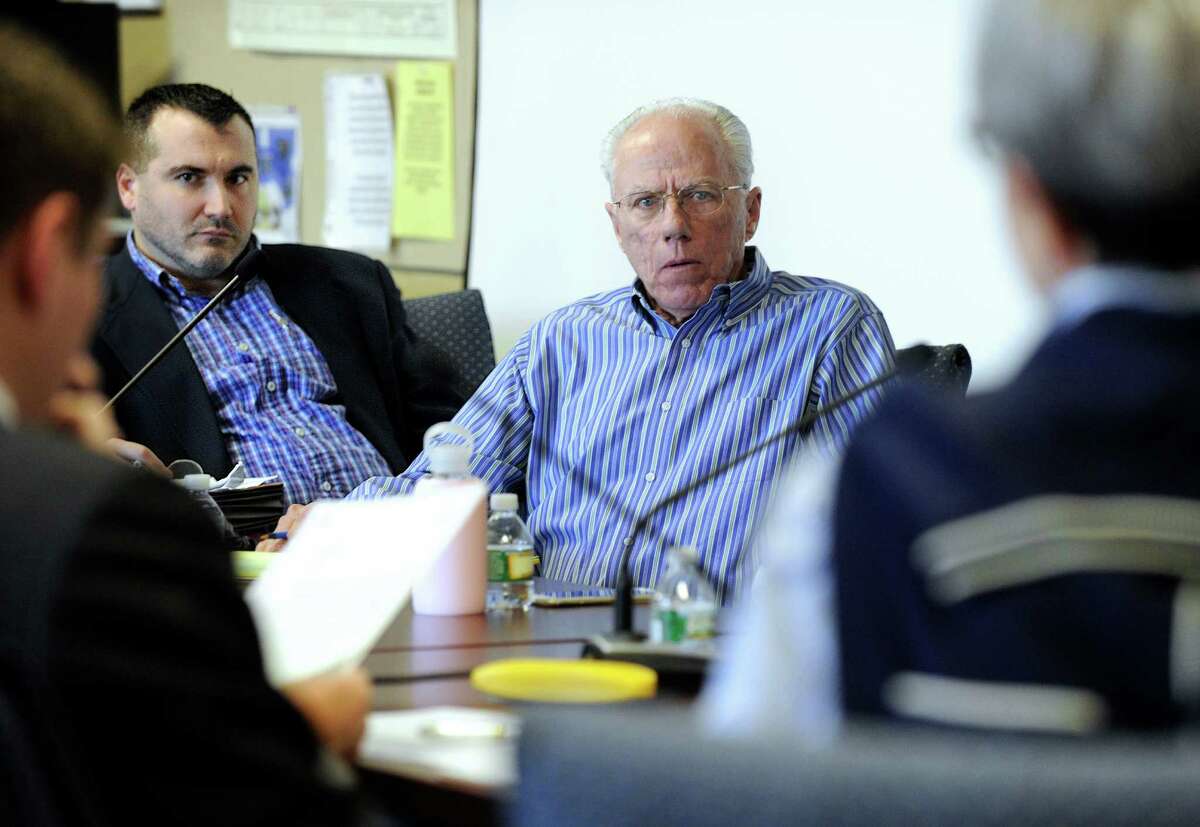 Matt Grimes, left, former chairman of the Republican Town Committee in Brookfield and Thomas Dunkerton, Republican registrar, listen during Jane Miller's hearing in her request to be reinstated in the Republican party, Monday, April 18, 2016.