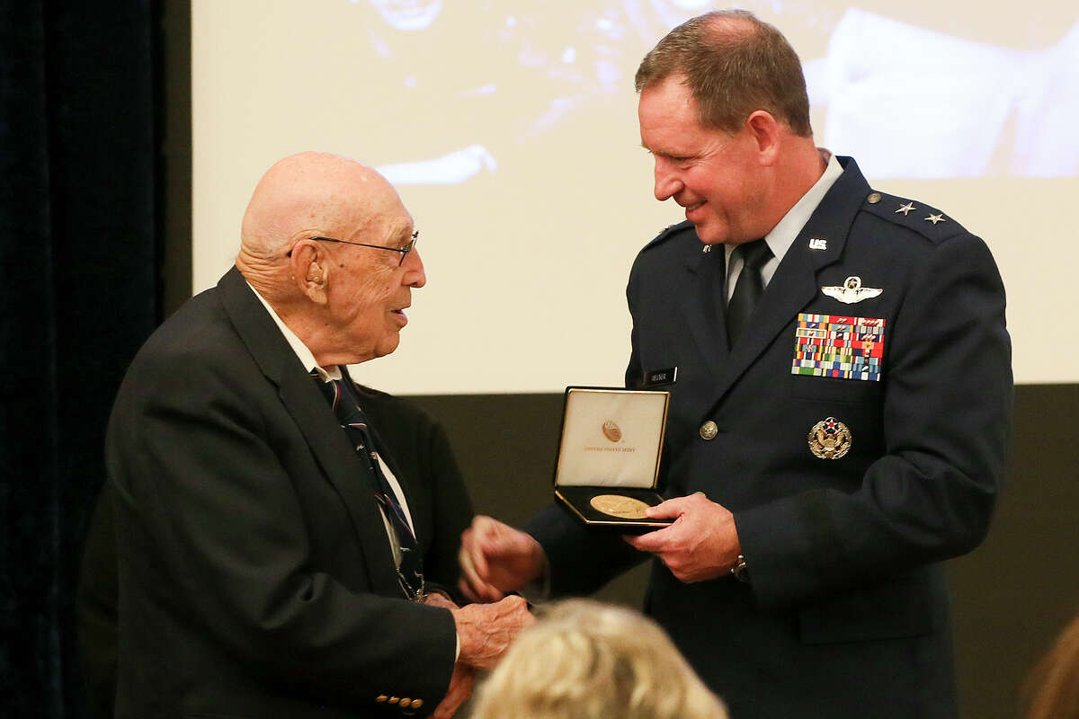 Maj Gen. James B. Hecker, Commander, 19th Air Force, Joing Base San Antonio-Randolph (right) presents retired Air Force Col. Dick Cole with the Congressional Gold Medal during a ceremony toasting Cole and his fellow Doolittle Raiders at Joint Base San Antonio-Randolph on the 74th anniversary of the famous Tokyo raid on Monday, April 18, 2016. Cole, 100-years old, is one of two remaining survivors from the historic WWII mission. MARVIN PFEIFFER/ mpfeiffer@express-news.net