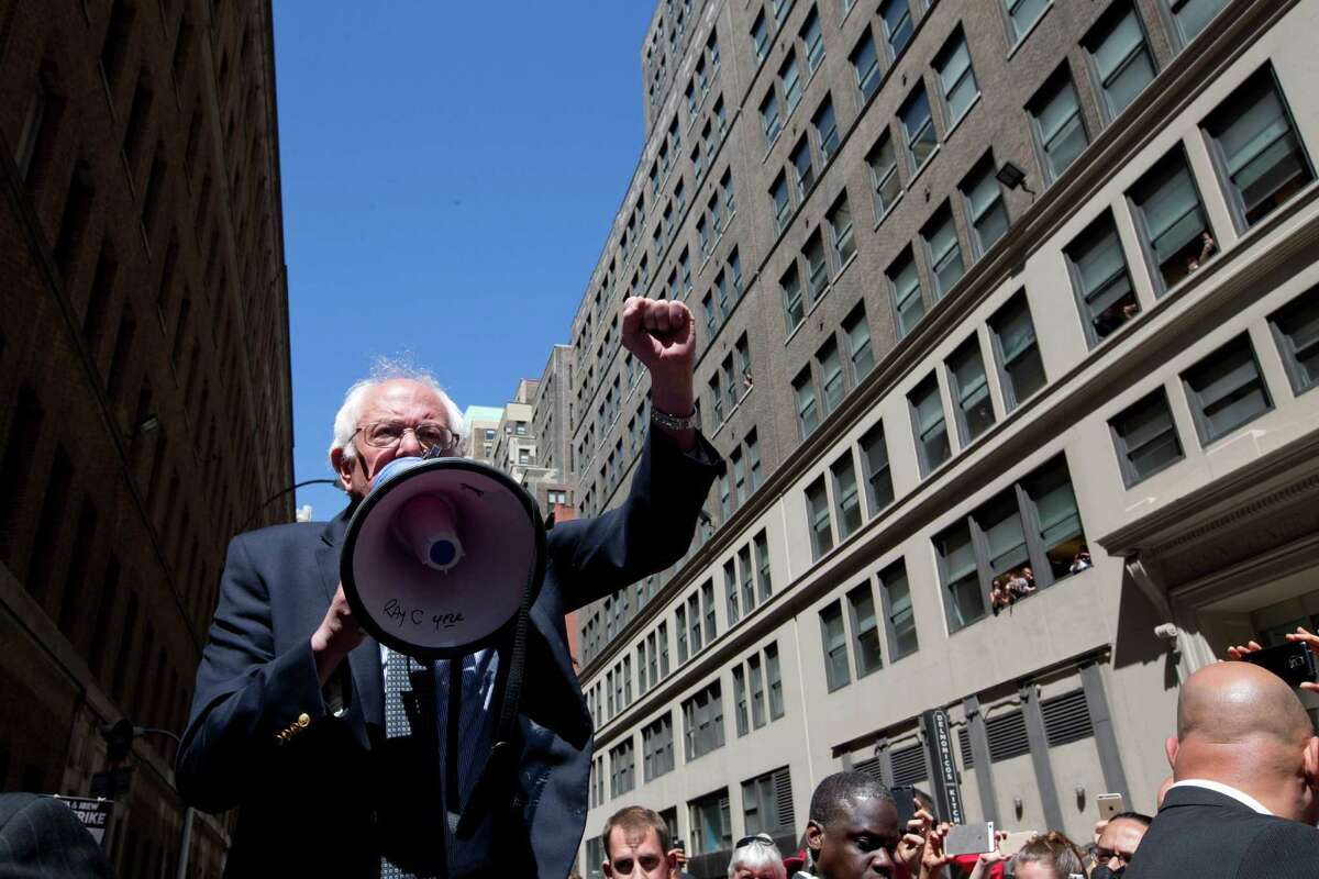 Democratic presidential candidate Sen. Bernie Sanders, I-Vt. speaks to Communication Workers of America (CWA) picketers in midtown Manhattan, N.Y., Monday, April 18, 2016. (AP Photo/Mary Altaffer) ORG XMIT: NYMA105