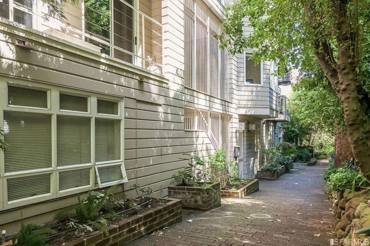 Coit Tower views and light, airy living spaces make this two-bedroom San Francisco condo cheerful. What's more, it's located on Macondray Lane, the cobblestone path that meanders through a lush garden on the southeastern side of Russian Hill.