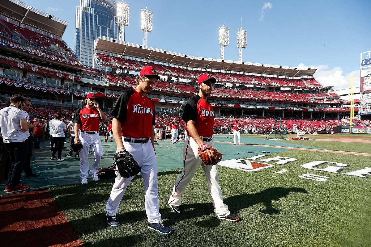 CINCINNATI, OH - JULY 14: National League All-Star Clayton Kershaw #22 of the Los Angeles Dodgers and National League All-Star Madison Bumgarner #40 of the San Francisco Giants take the field prior to the 86th MLB All-Star Game at the Great American Ball Park on July 14, 2015 in Cincinnati, Ohio. (Photo by Rob Carr/Getty Images)