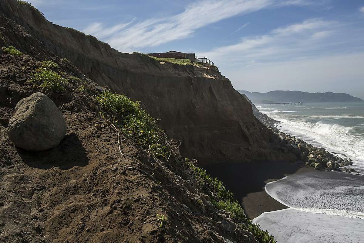 The McConnell's home is seen on Tuesday, April 19, 2016 in Pacifica, Calif. The McConnell's cliffside home was yellow-tagged after waves pounded into the side of the cliff and eventually eroded the land. Medeiros-Wacker & Sons are working on a last ditch attempt to move and save the home, which is teetering on the edge of the cliff.