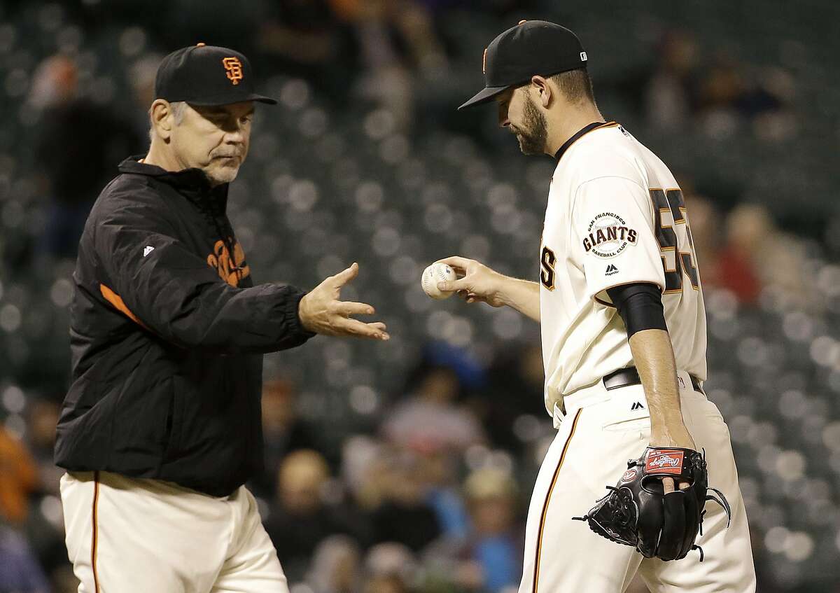 San Francisco Giants manager Bruce Bochy, left, takes the ball from pitcher Chris Heston (53) during the eleventh inning of a baseball game against the Arizona Diamondbacks in San Francisco, Monday, April 18, 2016. The Diamondbacks won 9-7 in 11 innings. (AP Photo/Jeff Chiu)