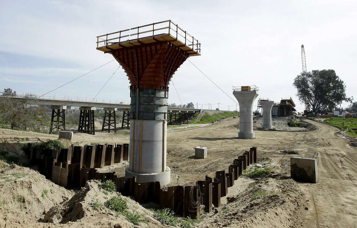 FILE - In this Friday, Feb. 26, 2016 file photo, the supports for a 1,600-foot-viaduct to carry high-speed rail trains across the Fresno River are seen under construction near Madera, Calif. On Monday, March 28, 2016, state lawmakers will have their first opportunity to quiz the officials responsible for California�s $64 billion high-speed rail plans at a committee hearing to review a new business plan that calls for overhauling its proposed route and postponing the first service by three years. (AP Photo/Rich Pedroncelli)