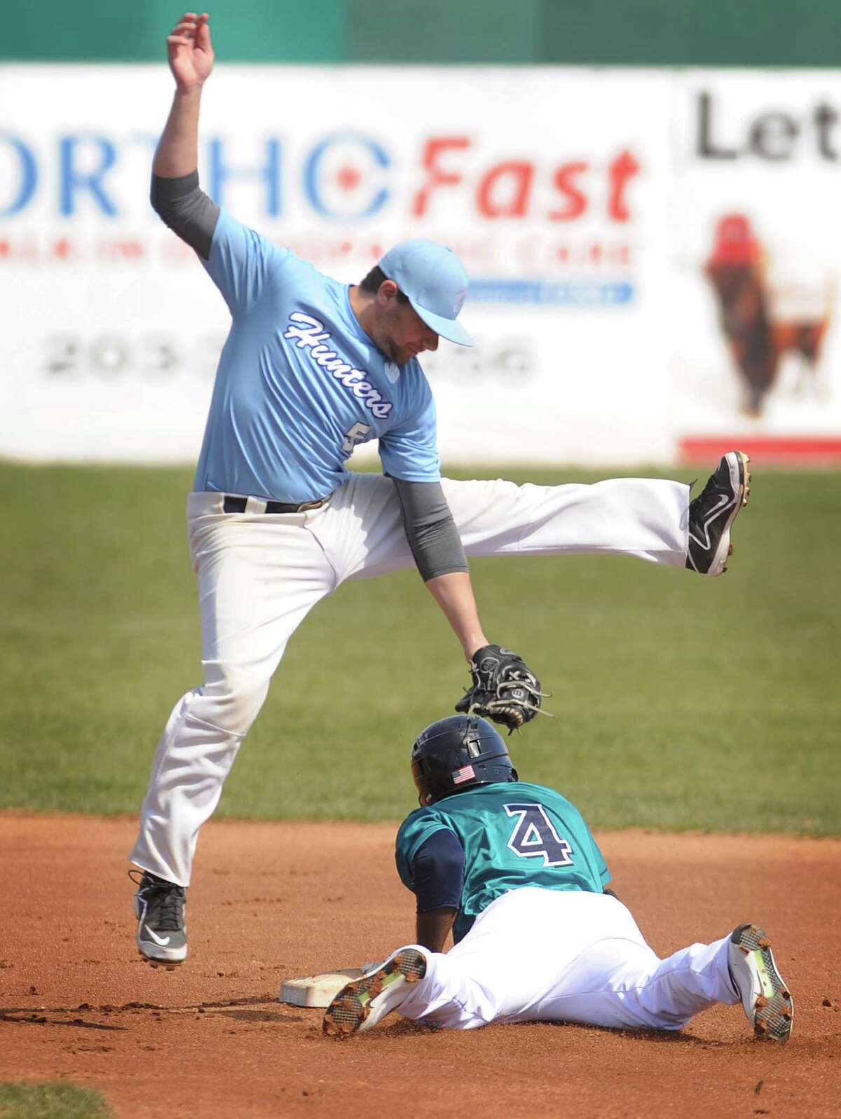 Bluefish Ruben Sosa, Jr. steals second base as Milford Hunters' shortstop John Ascenzia takes the high throw from catcher during the first inning of their spring training baseball game at Harbor Yard Ballpark in Bridgeport, Conn. on Tuesday, April 19, 2016.