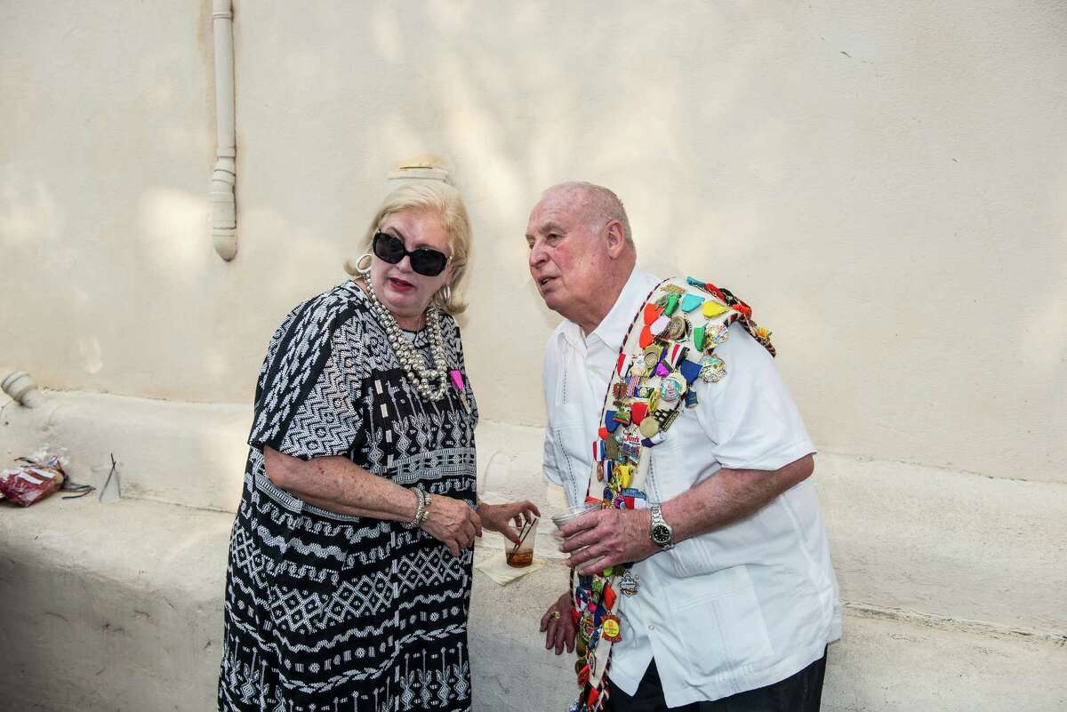 Nancy Avellar, left, former president and chairman of NIOSA, and Ron Stinson, right, attend the King's Party at NIOSA during Fiesta week in San Antonio, Texas in La Villita on Tuesday, April 19, 2016.