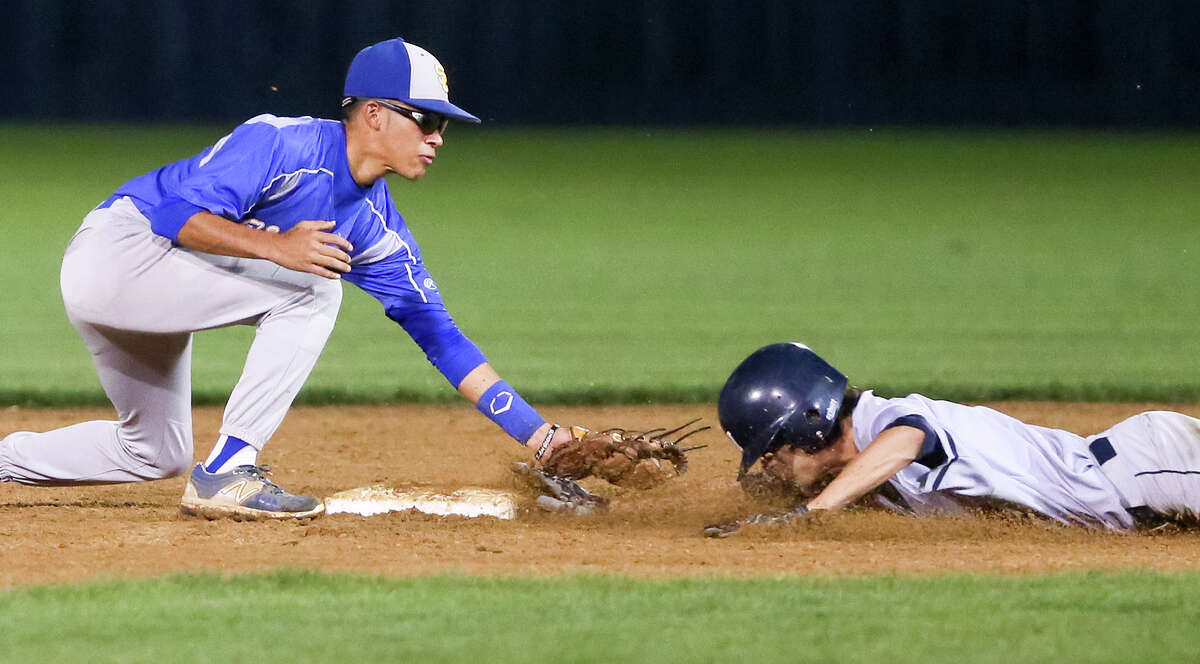 Clemens' J.J. Esquivel (left) tags out Smithson Valley's Mason Minister at second base during the fifth inning of their District 25-6A baseball game at Smithson Valley on Tuesday, April 19, 2016. Clemens beat Smithson Valley 8-1. MARVIN PFEIFFER/ mpfeiffer@express-news.net