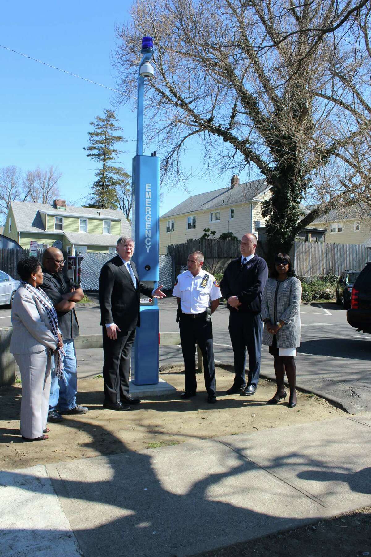 Stamford officials unveil new Blue Light Emergency Phone and Camera in Lione Park on Tuesday, April 19, 2016. The same style of beacon will be installed in Hatch Field Park on the West Side after a spate of violence.