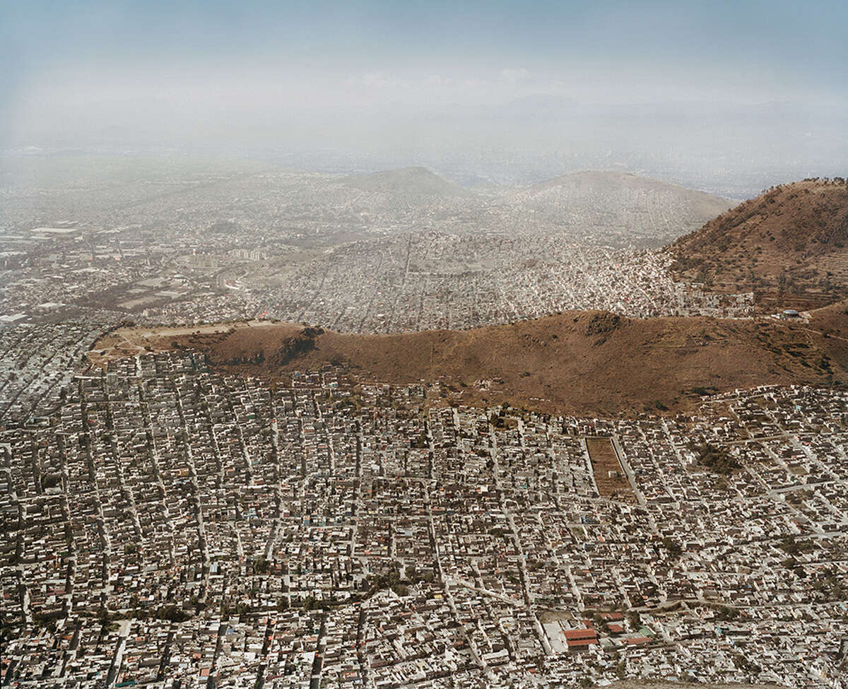 A photograph from Pablo Lopez Luz's "Terrazo" series showing aerial views of Mexico City; one of the series on view during the FotoFest 2016 Biennial.