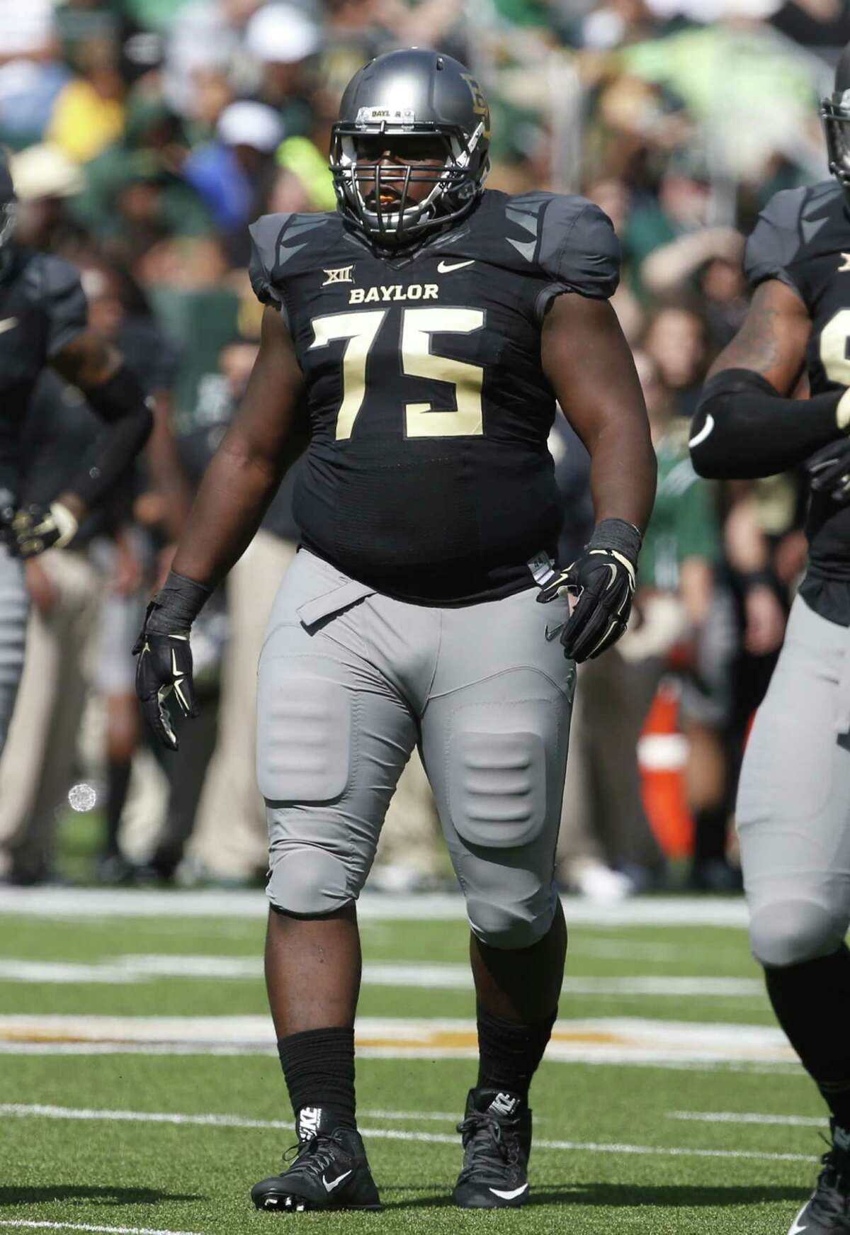 Baylor defensive tackle Andrew Billings (75) waits for a play to begin against West Virginia in the second half of an NCAA college football game, Saturday, Oct 17, 2015, in Waco.
