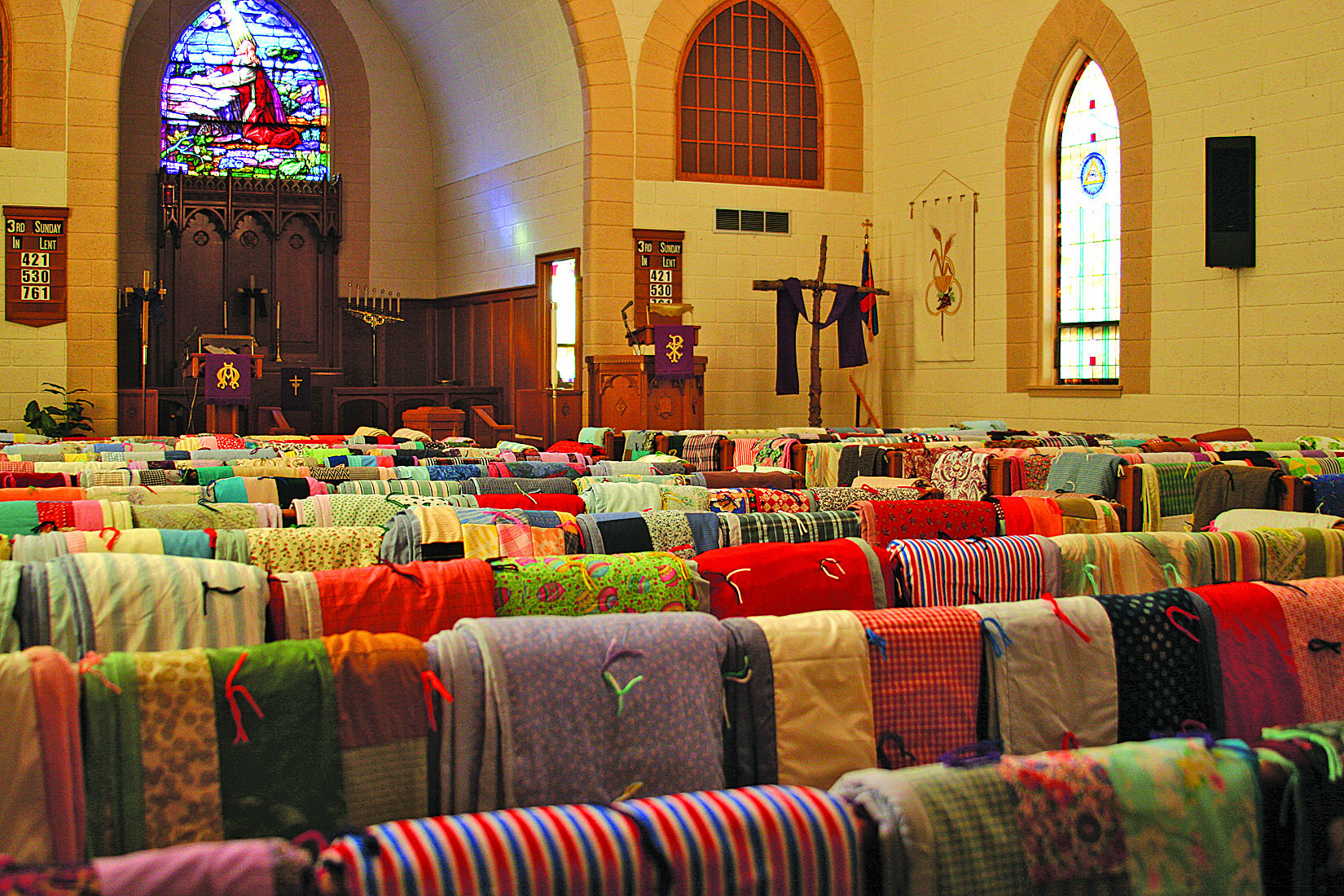 A Thumb patchwork; Church women make hundreds of quilts for the needy