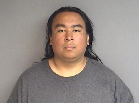 Homeless man accused of throwing brick through car window, stealing bag