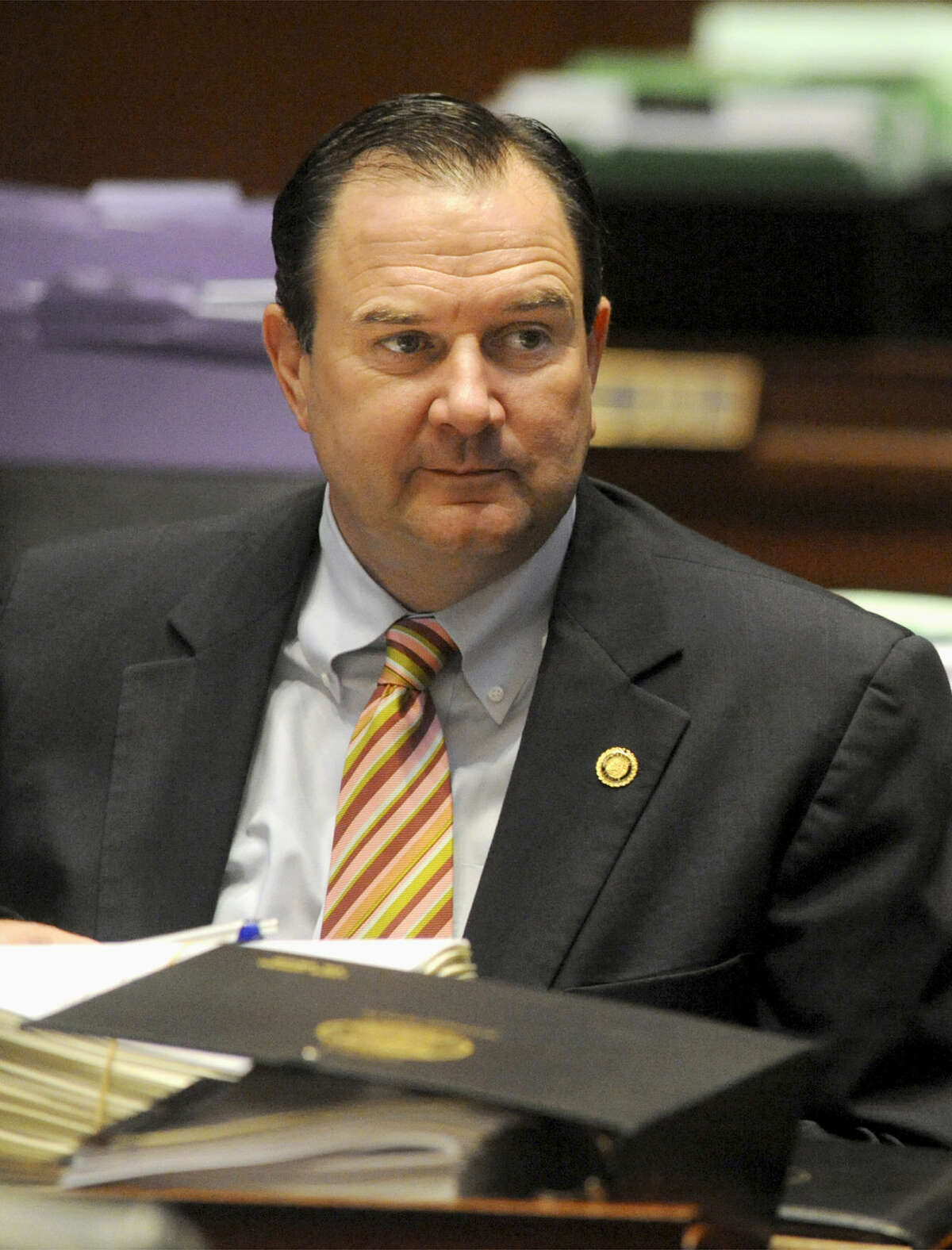 FILE - In this May 2, 2011, file photo, Sen. Mike Kehoe, R-Jefferson City, listens to colleagues debate at the Missouri Capitol in Jefferson City. Kehoe backed a Missouri law, which took effect in 2016, cutting the maximum length of time that people can receive unemployment benefits to as few as 13 weeks. (AP Photo/Kelley McCall, File)