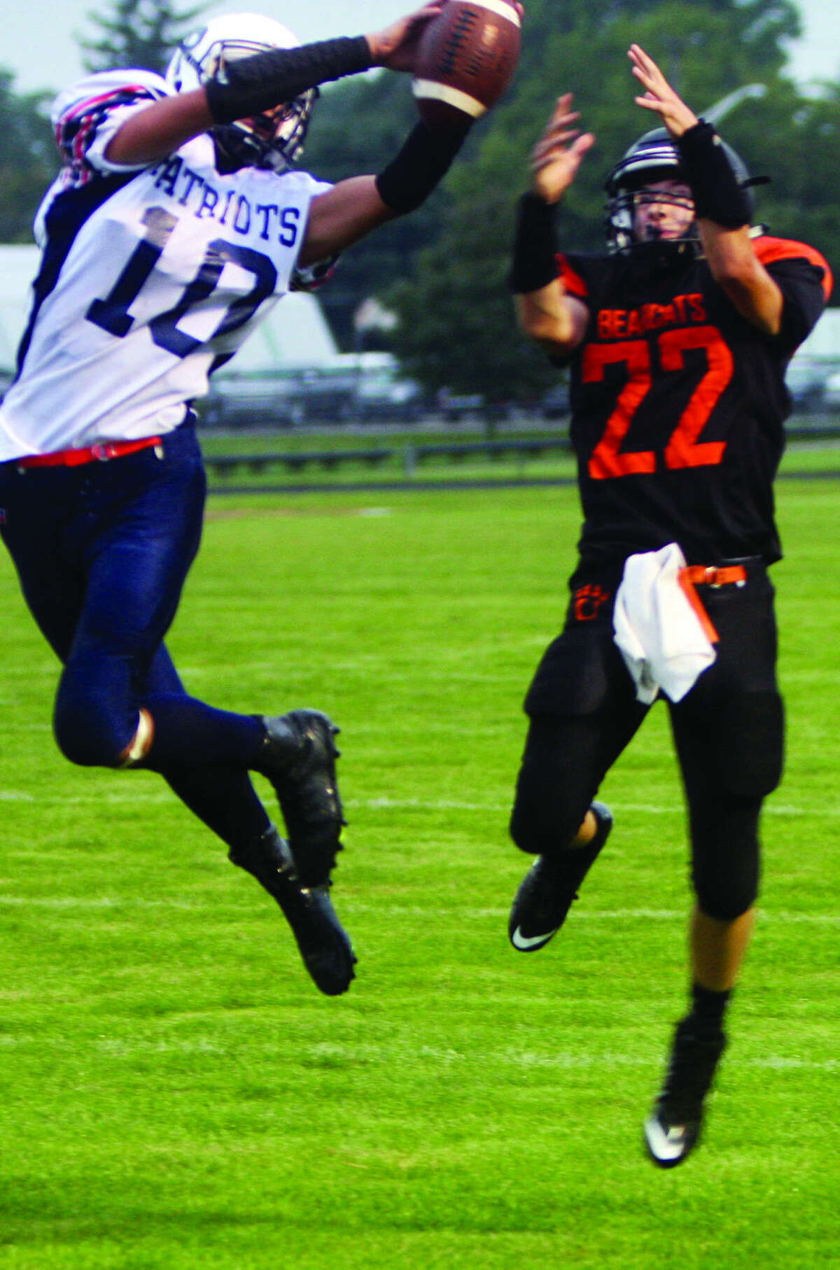 USA defensive back Aaron Saenz (10) tips a pass intended for Ubly’s Jonathon Brandel (22) during the first half of the Patriots’ 28-26 victory, Thursday night in Ubly.  