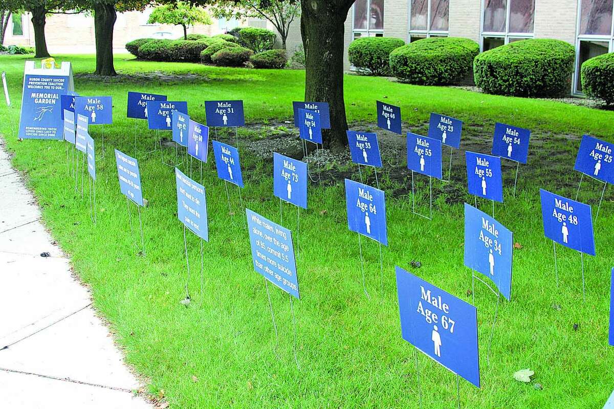 Signs in Huron County’s Memorial Garden in front of the courthouse remind us of the toll of suicide. Experts say listening can make a big difference for those exhibiting warning signs. (Tribune File Photo)