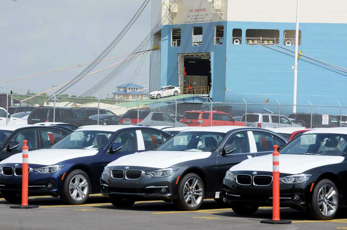 New vehicles roll out of a transport ship at the new BMW Vehicle Distribution Center on Harborside Drive in Galveston Wednesday April 20,2016(Dave Rossman Photo)
