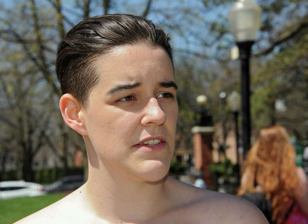 Cedar Brock talks about her experience as Sage students, upset by police treatment of her, who identifies as androgynous, hold a topless protest in Sage Park on the Russell Sage College campus Wednesday, April 120, 2016 in Troy, N.Y. A school security officer approached Cedar, who was sunbathing topless in a public park that fronts the campus. (Lori Van Buren / Times Union)