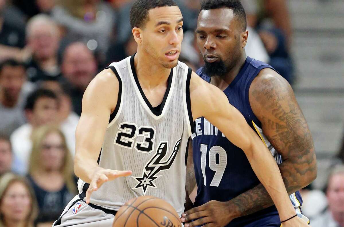 Spurs’ Kevin Martin looks for room around Memphis Grizzlies’ P.J. Hairston during second half action of Game 1 in the first round of the Western Conference playoffs Sunday April 17, 2016 at the AT&T Center.
