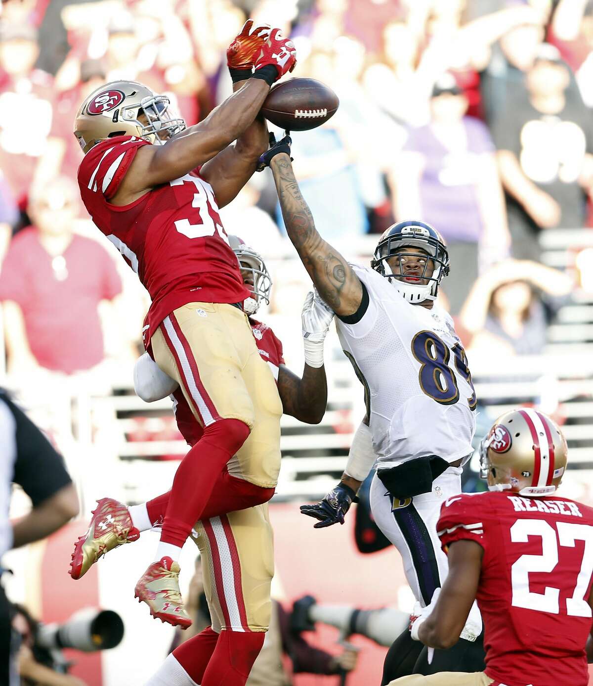 San Francisco 49ers' Eric Reid breaks up pass to Baltimore Ravens' Steve Smith, Sr. during final seconds of Niners' 25-20 win in NFL game at Levi's Stadium in Santa Clara, Calif., on Sunday, October 18, 2015.
