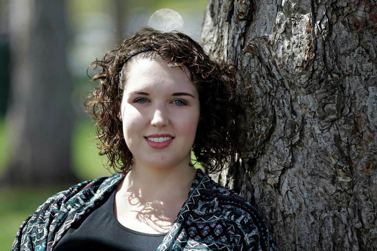 In this April 19, 2016 photo, Madeline MacDonald poses for a photograph, in Provo, Utah. MacDonald said she reported being sexually assaulted during her freshman year at Brigham Young University. She is among other students who say they have been sexually assaulted and find themselves under investigation for possible violations of the Mormon school's code against sex and drinking. (AP Photo/Rick Bowmer)