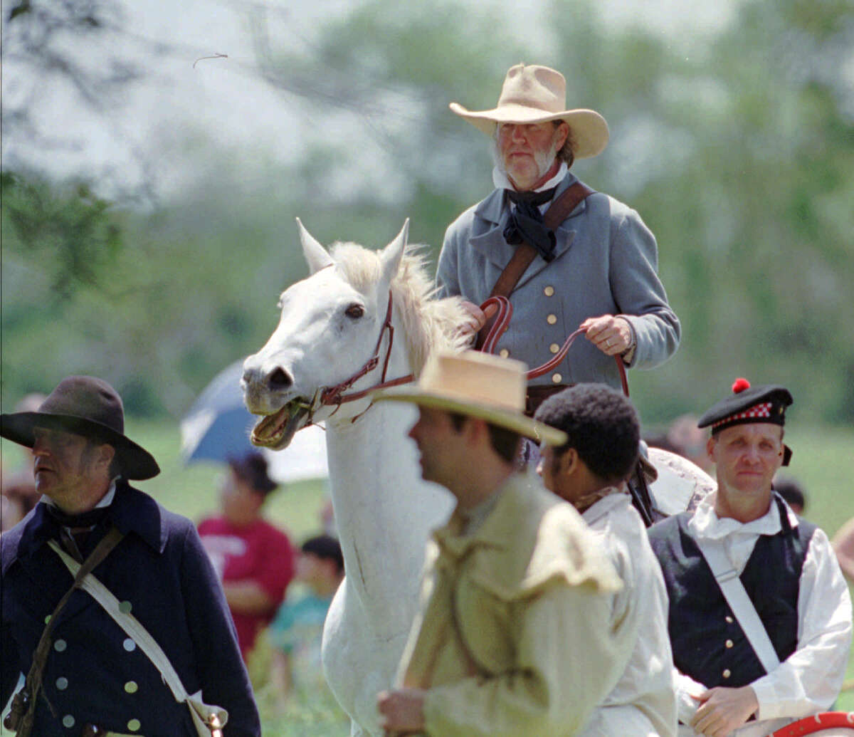 An actor portraying General Sam Houston rides with his Texas troops during a reenactment of the Battle of San Jacinto. (AP file photo)
