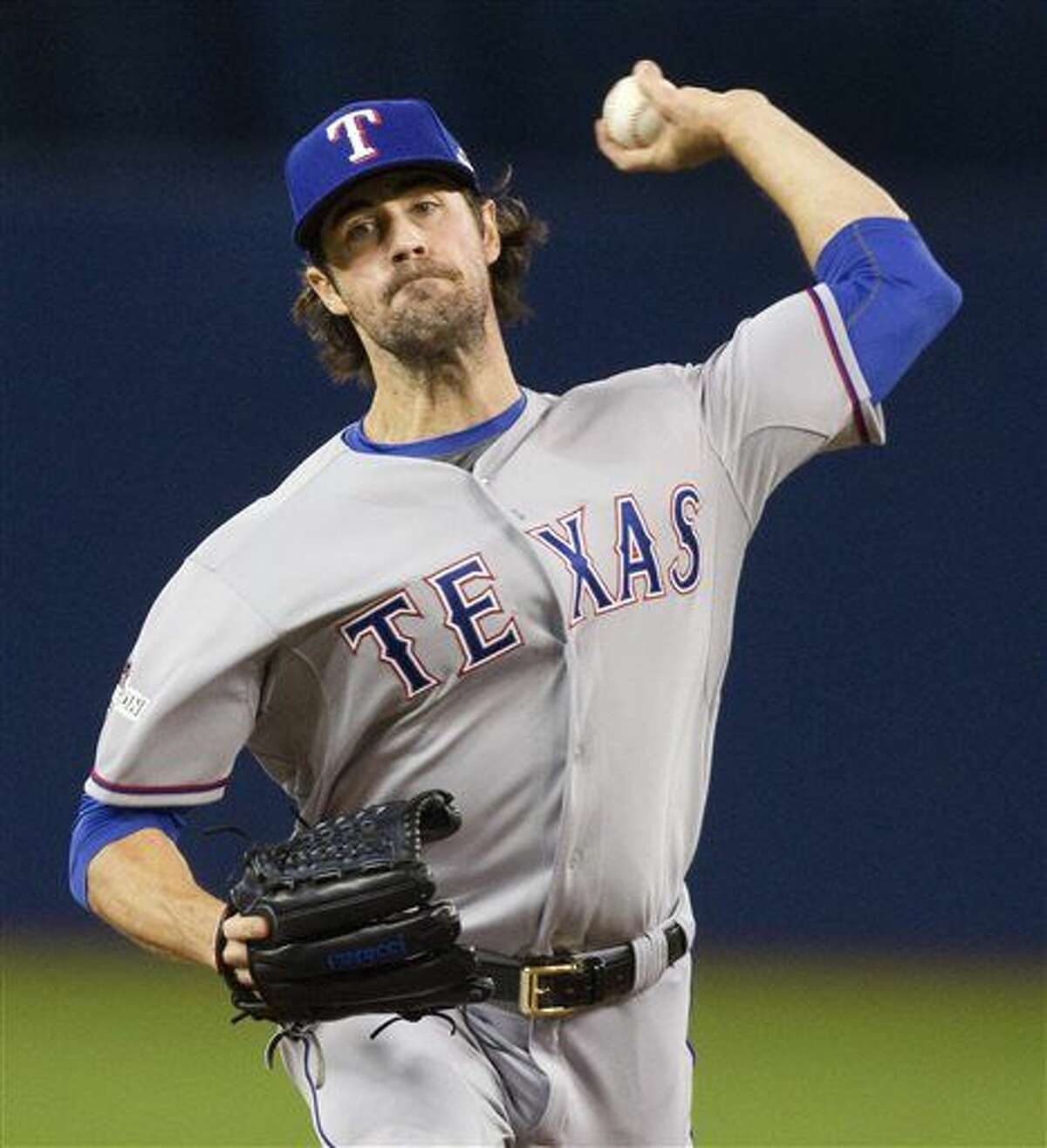 In this Oct. 9, 2015, file photo, Texas Rangers pitcher Cole Hamels throws against the Toronto Blue Jays in the first inning in Game 2 of baseballs American League Division Series in Toronto. Hamels has been picked to start on opening day for the AL West champion Texas Rangers, manager Jeff Banister announced Wednesday, March 23, 2016. (Fred Thornhill/The Canadian Press via AP, Pool, File)
